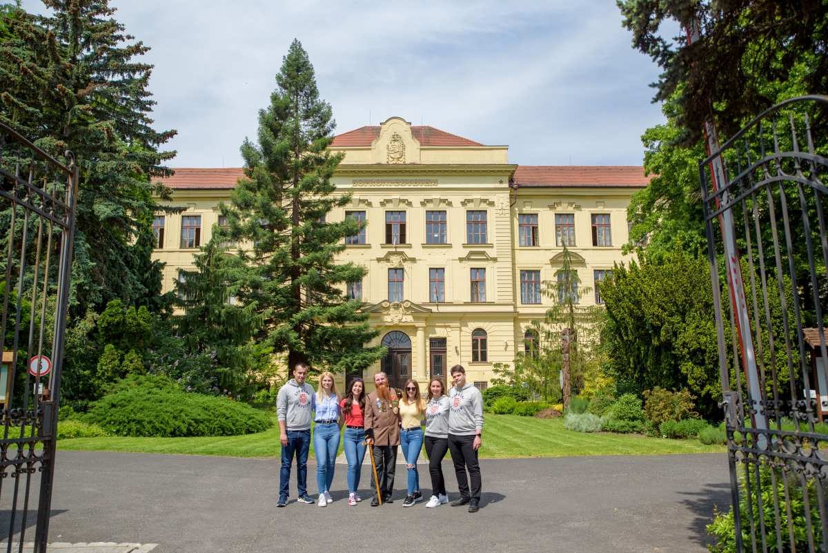 Students gathered outside a historic European university building
