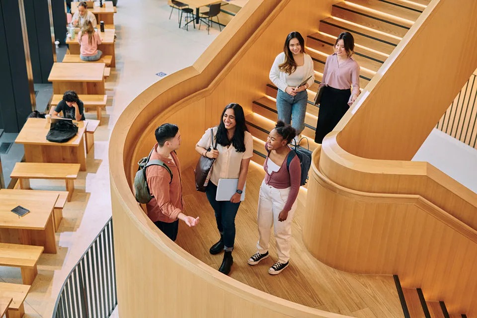 International students meeting inside a modern university building